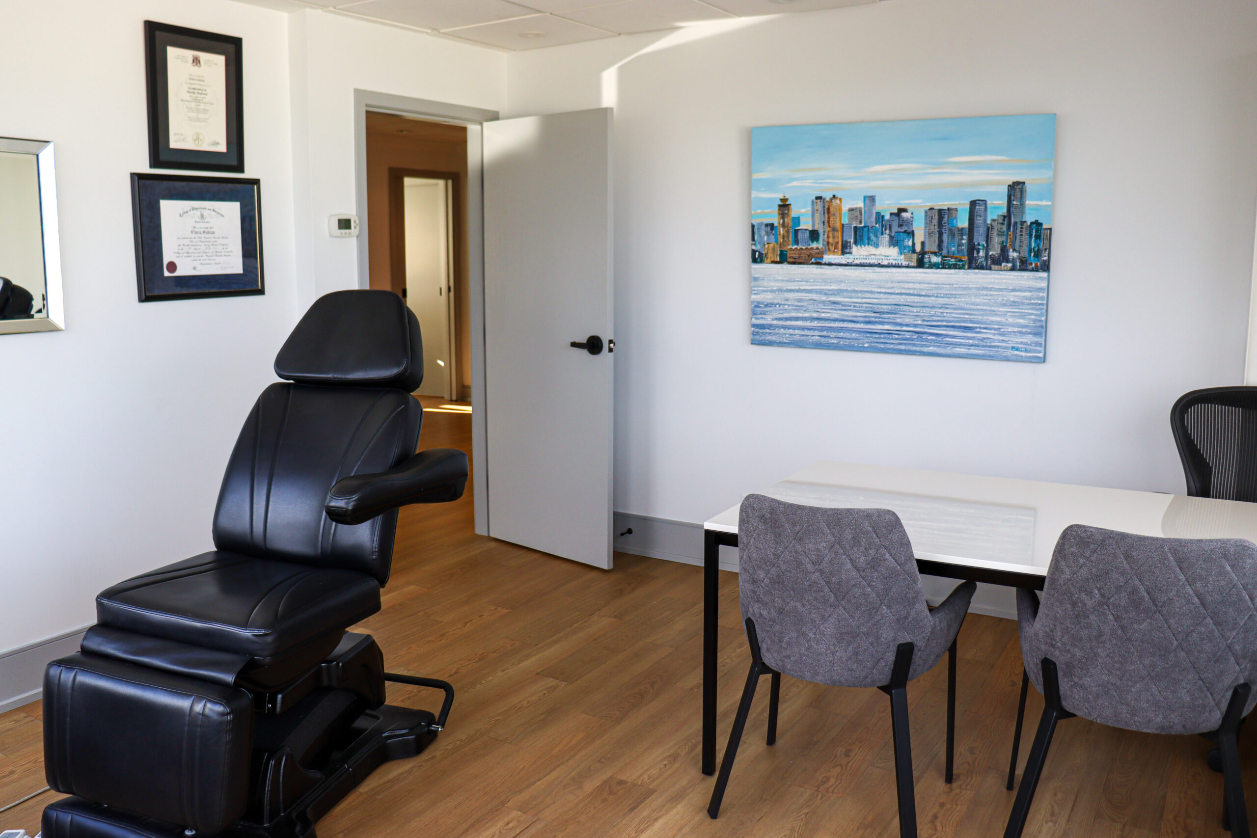 A room with a chair and a table.
